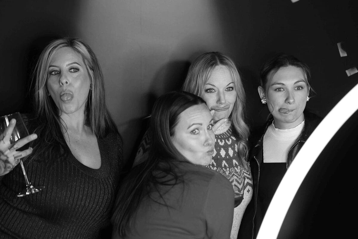 A group of women posing for the camera.